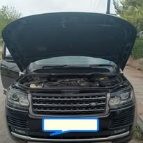 Workshop team servicing a vehicle